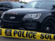 AI generated image of a police car behind yellow caution tape